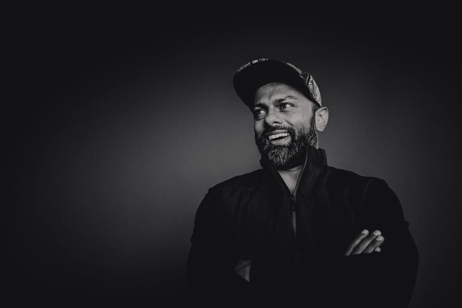 Hamish Cramer photographed in a dark studio.